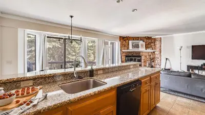 a kitchen with a sink and a counter top at Marillac by AvantStay Gorgeous Ski Cabin w Balcony Patio in Olympic Valley