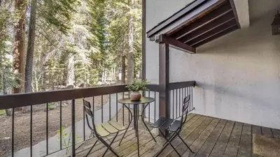 a balcony with a table and a potted plant at Marillac by AvantStay Gorgeous Ski Cabin w Balcony Patio in Olympic Valley