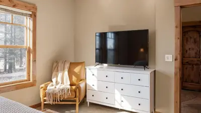 a bedroom with a tv on top of a dresser at Lakefront Home in Kings Beach w Views • Prime Location Atkinson by Avantstay in Tahoe Vista