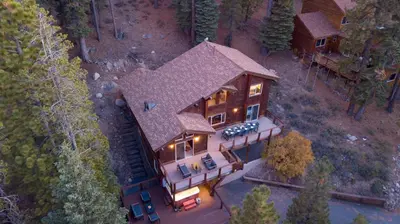 an overhead view of a large house with lights on at Redwood by AvantStay Secluded Cabin w Views Spa 5mins to NorthStar in Ponderosa Fairway Estates