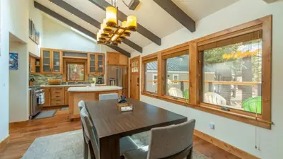 a large kitchen with a wooden table and chairs at Henderson by AvantStay Lake View Walk to Beach Garwoods More in Carnelian Bay