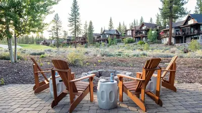 two chairs and a fire hydrant on a patio at Quartz by AvantStay Stunning Home In Truckee w Views in Ponderosa Fairway Estates