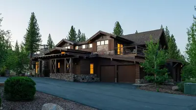 a house with a garage and a driveway at Quartz by AvantStay Stunning Home In Truckee w Views in Ponderosa Fairway Estates