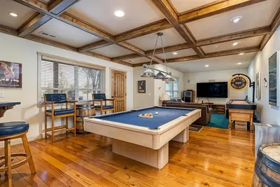 a living room with a pool table in it at Lakefront Casa Cassaretto in Groveland