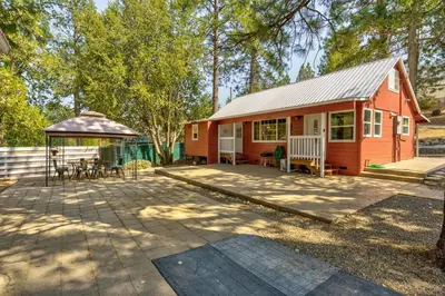 a red house with a gazebo and a patio at Acorn Cabin - Charming Place, Your getaway to Yosemite, Bass Lake in Oakhurst