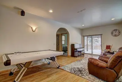 a living room with a pool table and a couch at Lukins Lodge By The Lake Hot Tub in South Lake Tahoe