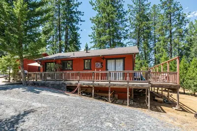 a home with a large deck and a house at Pet Friendly The Hideout Yosemite Home in Groveland