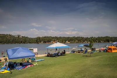 a group of people on a beach with umbrellas at Pet Friendly The Hideout Yosemite Home in Groveland