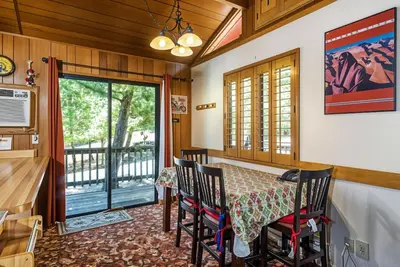 a dining room with a table and chairs at Pet Friendly The Hideout Yosemite Home in Groveland