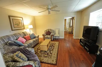 a living room with a couch and a tv at Yosemite Villa - Only 0,3 Miles from Lake Lodge Beach and Playground in Groveland