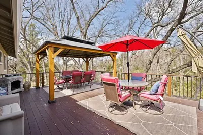 a patio with a table and chairs and a gazebo at Bigfoot Retreat Home Close to Beach in Groveland