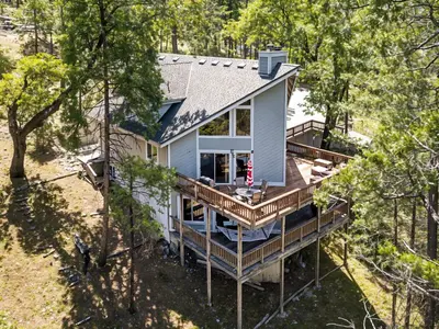 an aerial view of a house with a deck at Miner's Claim - Home with 2 Decks & Pool in Groveland