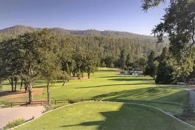 a view of a golf course with a green at The Big Easy Lakefront Cabin in Groveland