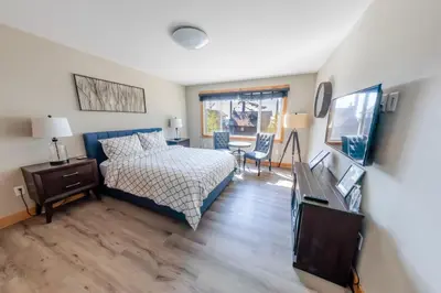a bedroom with a bed and a table and chairs at Lakeside Hotel room #7 in Kings Beach in Kings Beach