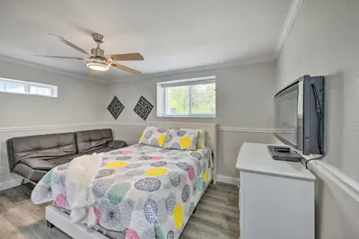 a bedroom with a bed and a flat screen tv at Cute Central Placerville Studio Pet Friendly in Placerville
