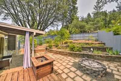 a patio with a fire pit in a garden at Less Than 3 Mi to Dtwn Placerville Home with Outdoor Oasis in Placerville