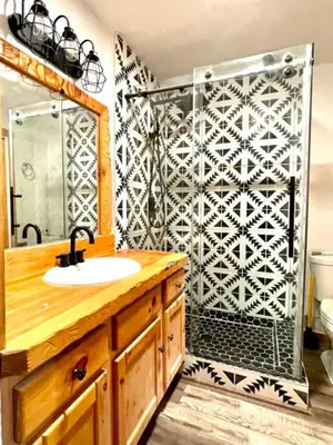 a bathroom with a sink and a shower at Top rated cabin w/spa Walk to the Village & Golf in Mammoth Lakes