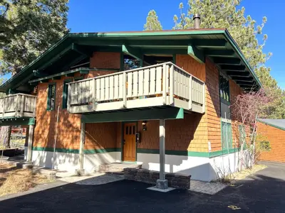 a building with a balcony on the side of it at Chateau Sans Nom #19 condo in Mammoth Lakes