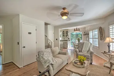a living room with a couch and chairs and a table at 1 Mi to Jenkinson Lake Apples Chalet with Deck in Pollock Pines