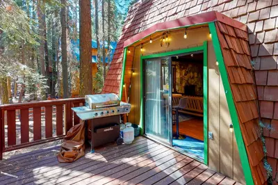 a small house with a grill on a deck at Chapel Grove in Tahoe City