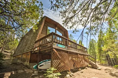 a tree house in the middle of the woods at Charming Pinecrest Cabin with Private Deck in Strawberry