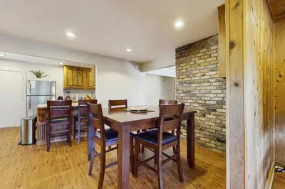 a kitchen and dining room with a wooden table and chairs at Escape at Edgewood in Stateline