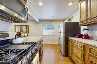 a kitchen with a stove and a refrigerator at Escape at Edgewood in Stateline