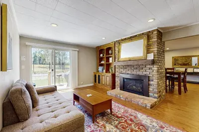 a living room with a couch and a fireplace at Escape at Edgewood in Stateline