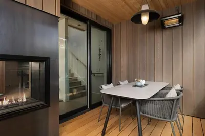 a dining room with a white table and chairs at Desolation Hotel in South Lake Tahoe