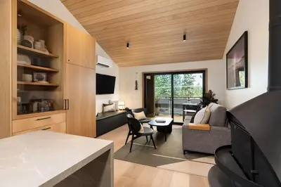 a living room with a couch and a table at Desolation Hotel in South Lake Tahoe