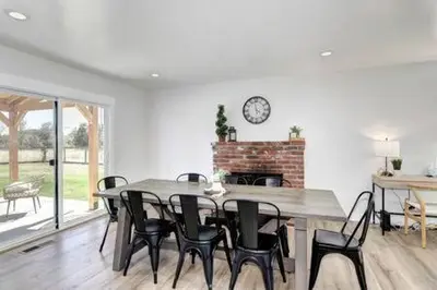 a dining room with a table and chairs and a fireplace at New Listing Country Property Pet Friendly W&D in Loomis