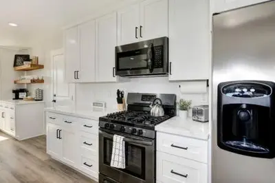 a white kitchen with a stove and a microwave at New Listing Country Property Pet Friendly W&D in Loomis