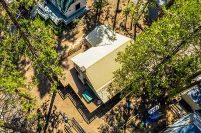 an overhead view of a building in the middle of trees at Alpine Cottage in Shaver Lake