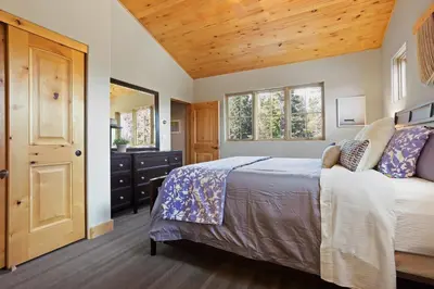 a bedroom with a bed and a wooden ceiling at Modern Condo - EV Plug In - SM 301 in Bear Valley