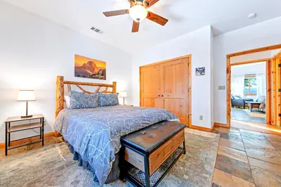 a bedroom with a bed and a ceiling fan at Oso Lodge in Yosemite West
