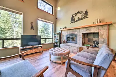 a living room with a couch and a fireplace at Hot Tub and Ski Shuttle Northstar Resort House in Truckee
