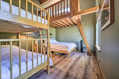 a bedroom with two bunk beds and a bed at Hot Tub and Ski Shuttle Northstar Resort House in Truckee