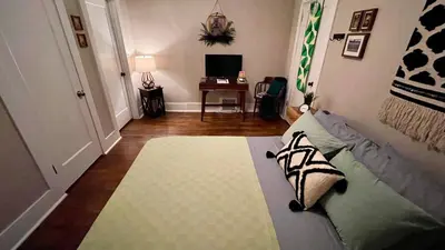a bedroom with a bed and a living room at 738 E Yale in Fresno