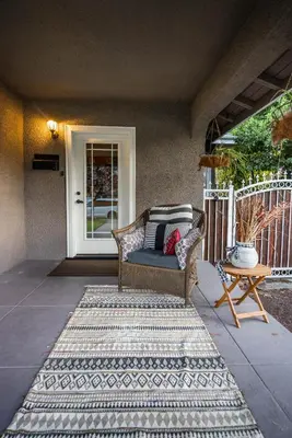 a porch with a couch sitting on a patio at 738 E Yale in Fresno