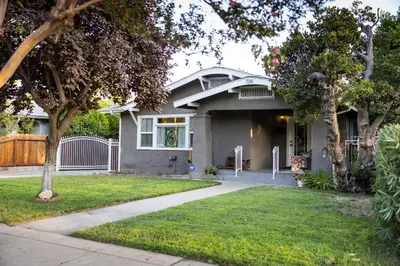 a gray house with a driveway in front of it at 738 E Yale in Fresno