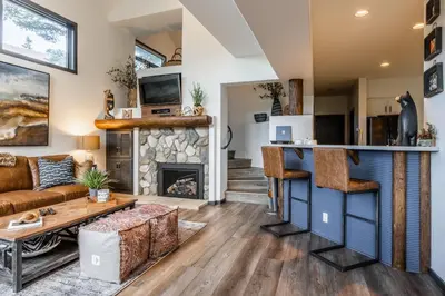 a living room with a bar and a fireplace at Great Views Fully Renovated Luxury 4 Bedroom 3 Full Bathrooms and Half Bath Snowcreek 732 Phase V in Mammoth Lakes