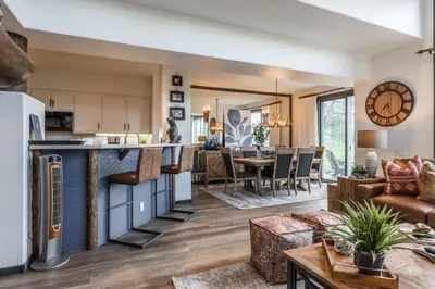 a living room and dining room with a kitchen and a living room at Great Views Fully Renovated Luxury 4 Bedroom 3 Full Bathrooms and Half Bath Snowcreek 732 Phase V in Mammoth Lakes