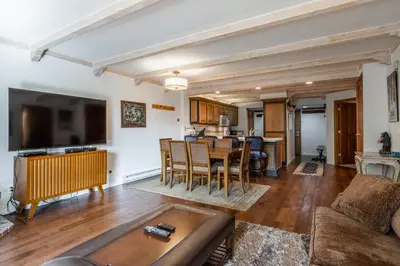 a living room with a couch and a table at Walk to Lift Updated 2 Bedroom 2 and a Half Bathrooms 1849 Condos 209 Steps to Canyon Lodge Sleeps 6 in Mammoth Lakes
