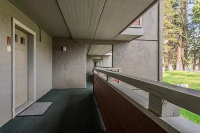 an empty hallway of a building with a window at Walk to Lift Updated 2 Bedroom 2 and a Half Bathrooms 1849 Condos 209 Steps to Canyon Lodge Sleeps 6 in Mammoth Lakes