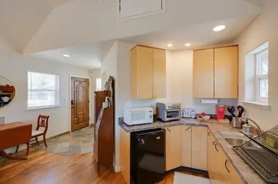 a kitchen with a sink and a microwave at Colfax Getaway with Hot Tub, Mountain Views! in Colfax