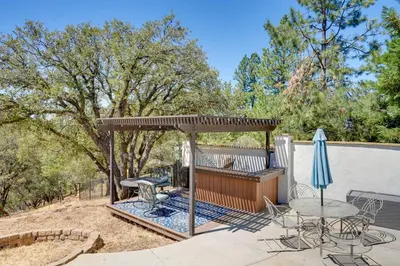 a patio with a gazebo and a table and chairs at Colfax Getaway with Hot Tub, Mountain Views! in Colfax