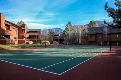 a tennis court in front of a building at Snowflower #87 condo in Mammoth Lakes