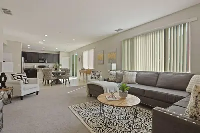 a living room with a couch and a table at Stunning River Islands Home Near Lake & Boat House in Lathrop
