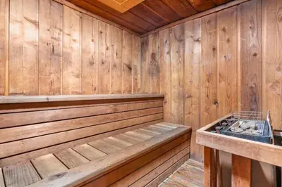 a wooden sauna with a bench and a sink at Perfect Ski Rental 2 blocks from Village Gondola in Mammoth Lakes
