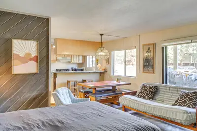 a living room with a couch and a table at Cozy Mammoth Lakes Studio 5 Mi to Ski Slopes in Mammoth Lakes
